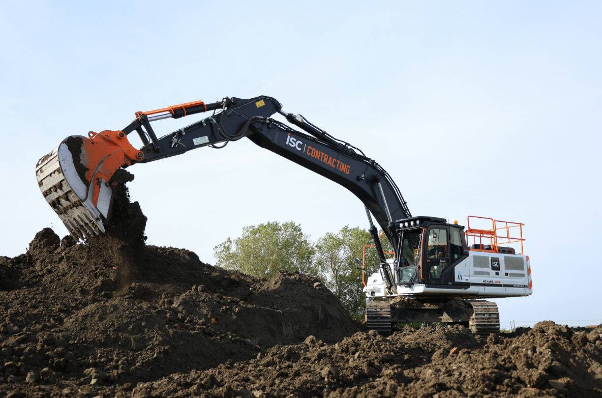 Excavator moving earth